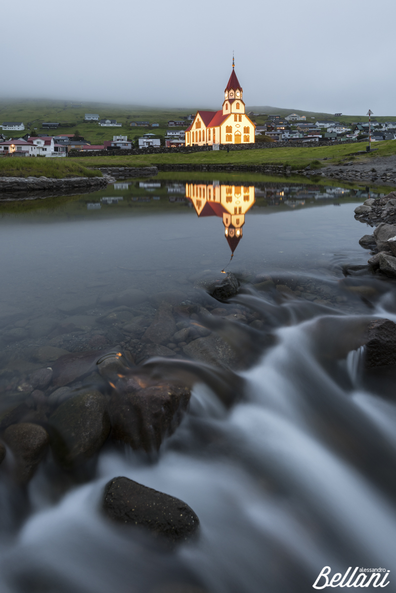 The church is reflected in the river FAROE ISLANDS